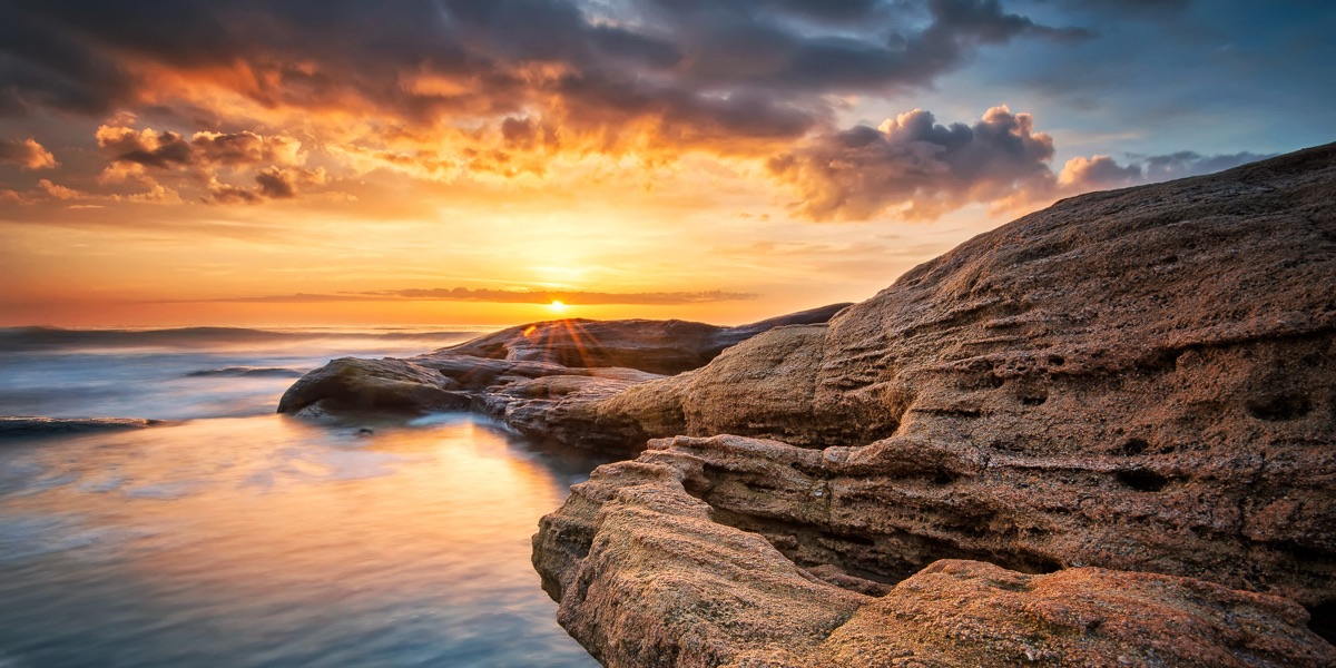 Rocks on a shore at sunset