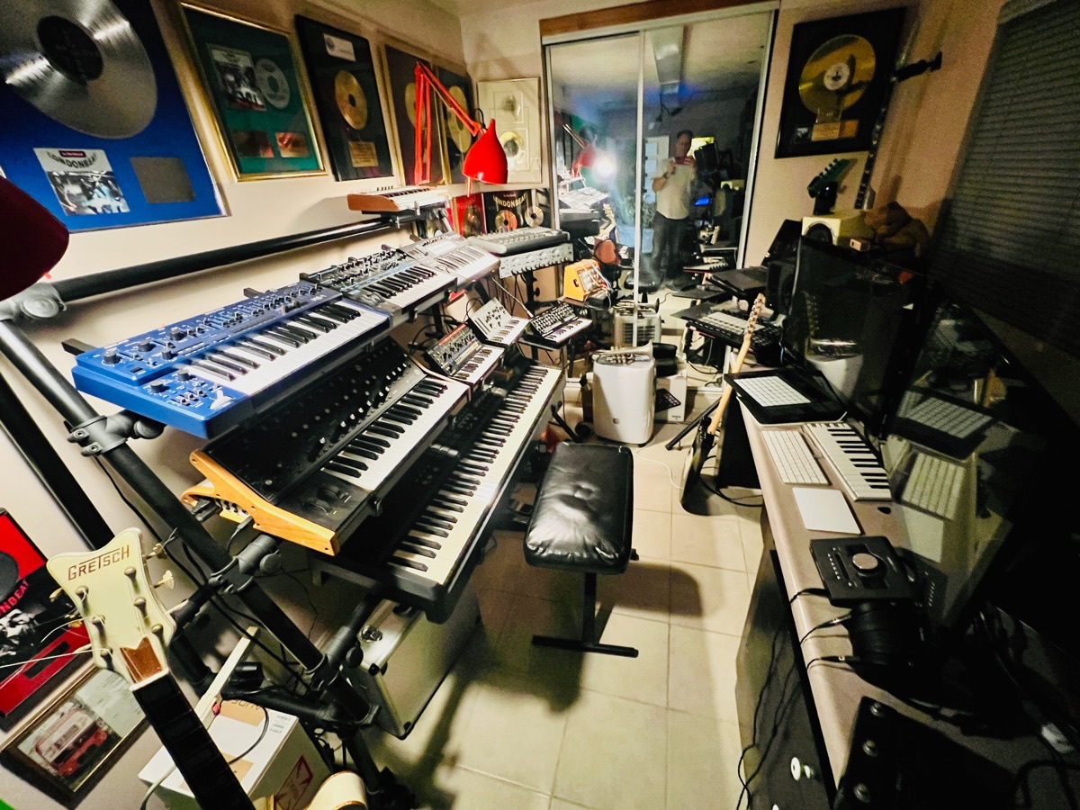 Racks of keyboards and synthesizers in Will's studio